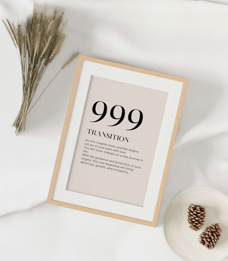 May include: A framed print with a beige background and black text. The text reads "999 TRANSITION As one chapter ends, another begins. Let go of your past with love. You will soon embark on a new journey in life. With the guidance and protection of your angels, this new beginning will bring about joy, growth, and prosperity."