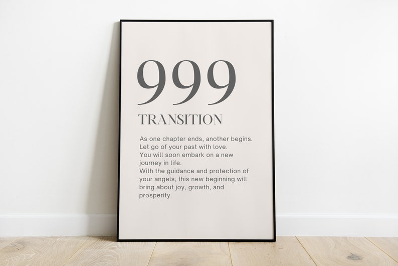 May include: A black framed poster with the number 999 and the word "TRANSITION" printed in gray. The poster includes a message about letting go of the past and embracing a new journey in life.