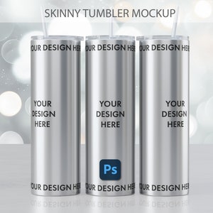 May include: Three silver skinny tumblers with clear lids and straws. The tumblers have the text "YOUR DESIGN HERE" printed on them.