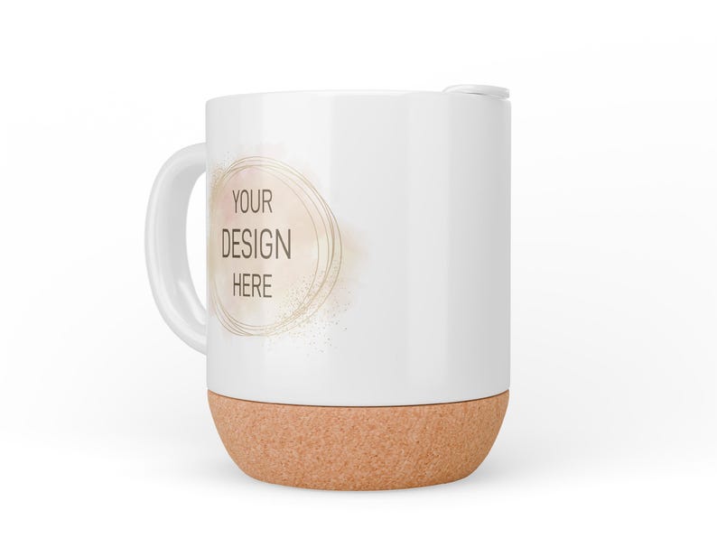 May include: White ceramic mug with a cork base. The mug has a gold circle with the text "YOUR DESIGN HERE" in the centre.