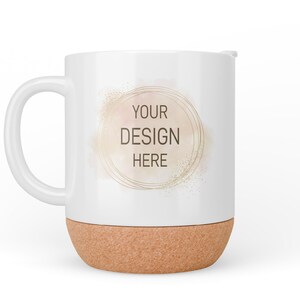 May include: White ceramic mug with a cork base. The mug has a gold circle with the text "YOUR DESIGN HERE" on it.