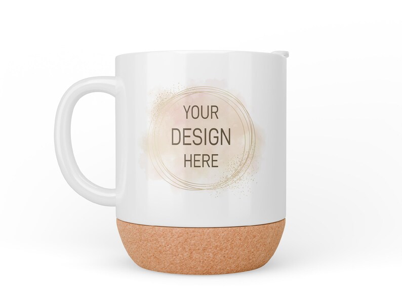 May include: White ceramic mug with a cork base. The mug has a gold circle with the text "YOUR DESIGN HERE" on it.