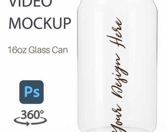 Puede incluir: Una maqueta de lata de vidrio transparente de 16oz con el texto "Your Design Here" escrito verticalmente en el lateral.