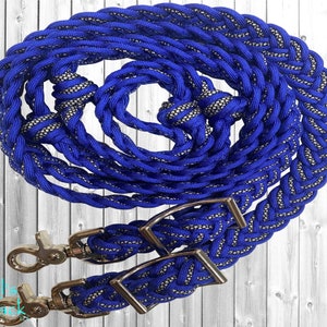 May include: Blue and silver braided reins with silver buckles and snap hooks.