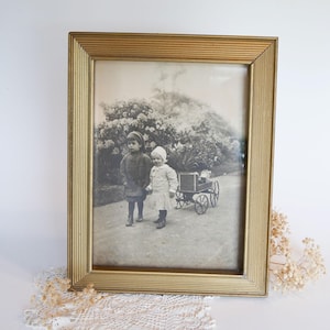 Vintage Gold Framed Black and White Children Photograph: Siblings with Wagon