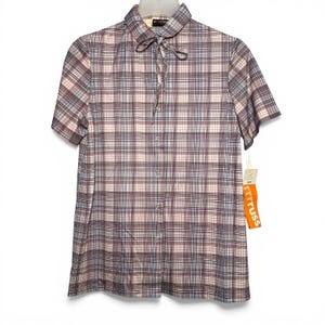 May include: Short-sleeved plaid shirt in a muted color palette of burgundy, blue, and cream. The shirt features a tie-neck collar and a button-down front. A tag with the text "TRUSS" is attached.