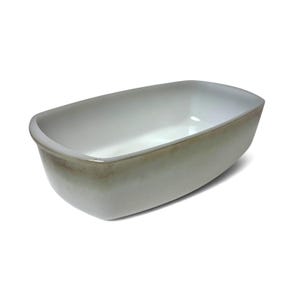 May include: A rectangular ceramic baking dish with rounded corners, featuring a smooth white interior and a light gray to beige gradient finish on the exterior sides. The vessel has a deep basin and a thick, uniform rim around the top edge.