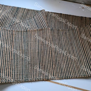 May include: A set of three woven striped rugs in beige and dark green. The rugs are made of natural fibres and have a textured surface.