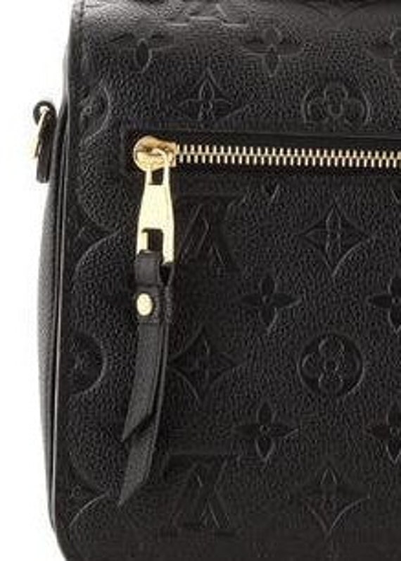 Exchanged my Pochette Metis - did I get a used one? The zipper is scratched  and the handle looks scratched as well. Didn't notice in the store. I also  feel like the