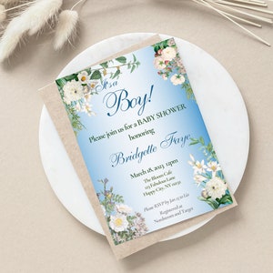 May include: A blue and white baby shower invitation with floral accents. The invitation reads "It's a Boy!" and includes the text "Please join us for a baby shower honouring Bridgette Faye" and details for the event.