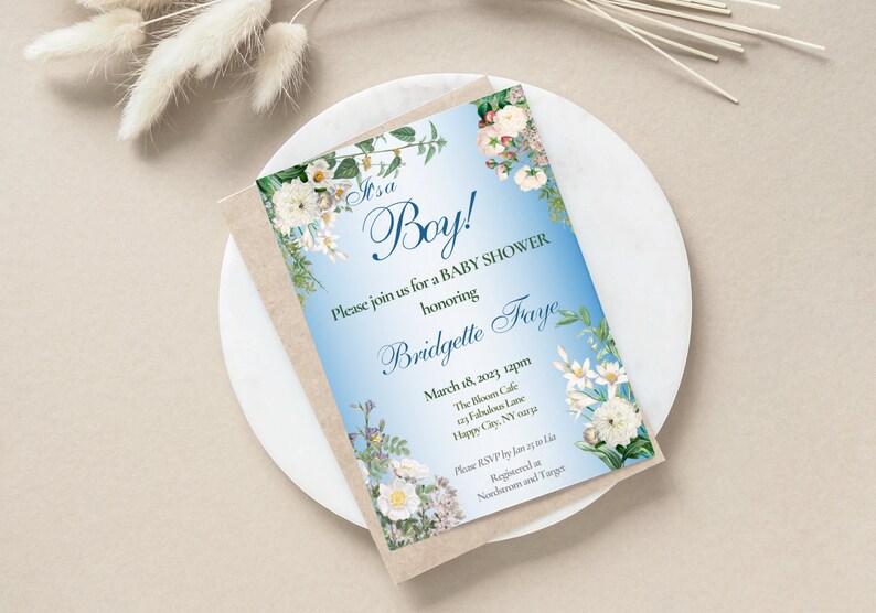 May include: A blue and white baby shower invitation with floral accents. The invitation reads "It's a Boy!" and includes the text "Please join us for a baby shower honouring Bridgette Faye" and details for the event.