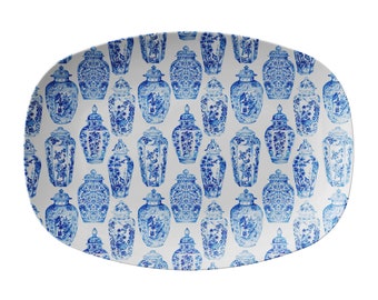May include: White oval serving platter with a blue and white pattern of Chinese porcelain vases.