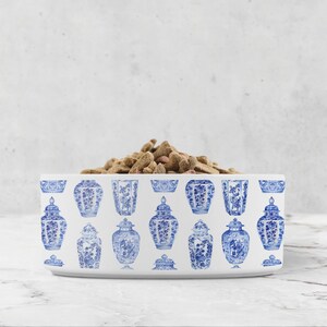 Blue and white ginger jars are printed all over a white ceramic pet bowl.