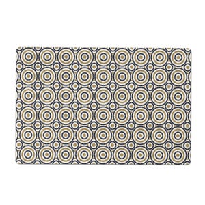 May include: Rectangular mat with a repeating pattern of concentric circles. The circles are in shades of navy blue, gold, and white, creating a geometric design. The mat has a clean, modern aesthetic, suitable for various home decor styles.
