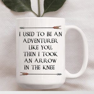 15 oz &quot;Arrow In The Knee&quot; Mug,  Fantasy Game Inspired, Arrow, Gamer, Adventurer, Birthday, Gift, Coffee Mug, Tea Mug