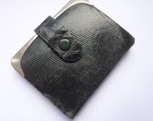 An antique early 20th century leather Allwood and Sons needle case purse sewing etui