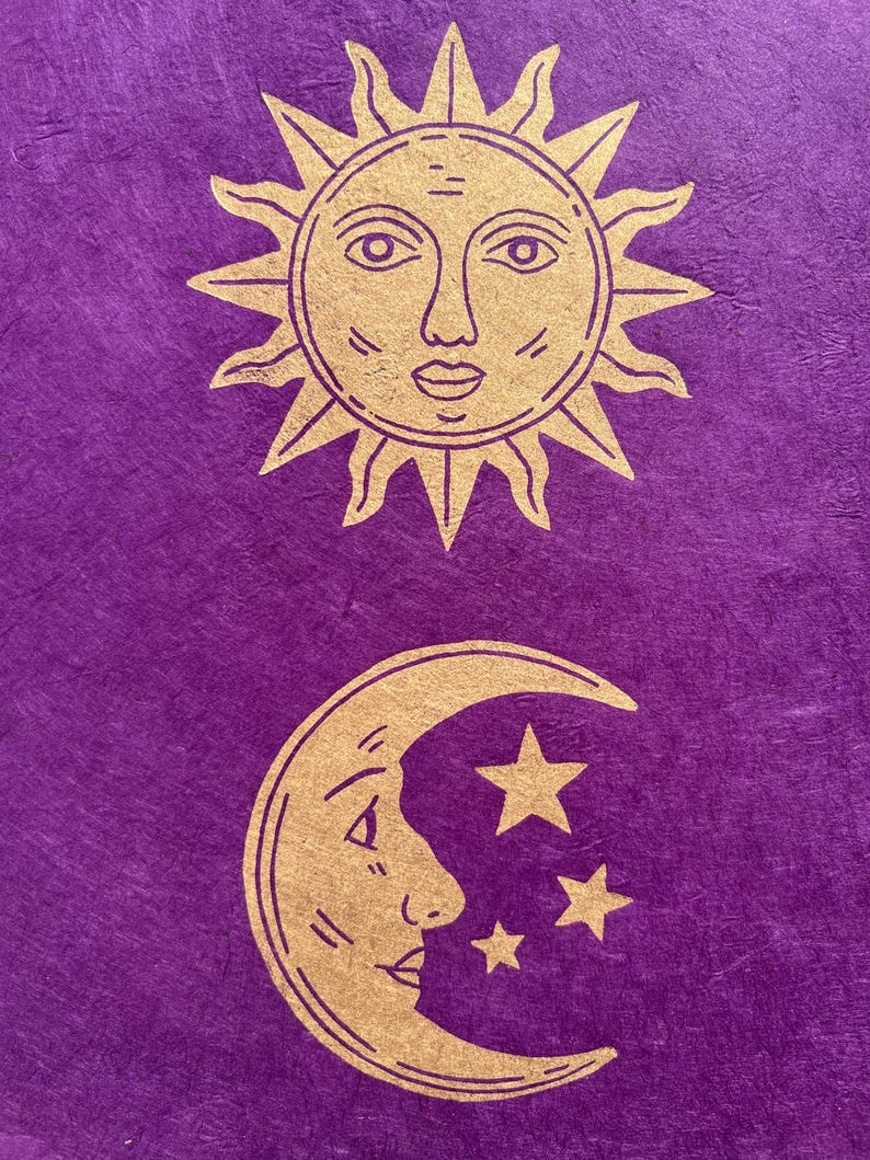 May include: A purple background with gold illustrations of celestial bodies. The top illustration is a sun with a face, and the bottom illustration is a crescent moon with a face and three stars. The design has a mystical theme.