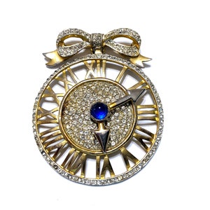 Castlecliff Gold Pave Rhinestones and Blue Cabochon Clock Face with Moveable Hands Pendant from a Bow Pin - Brooch