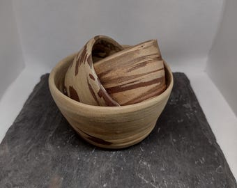 Set of three earthenware hand thrown snack and dipping bowls.