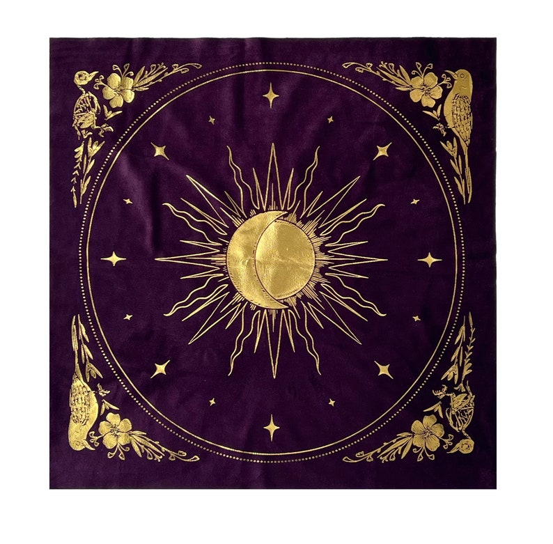 May include: A purple velvet tapestry with a gold sun and moon design. The sun and moon are surrounded by stars and floral accents.