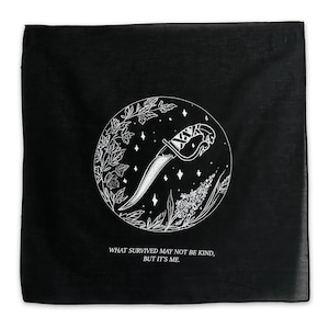 May include: Black bandana with a white illustration of a dagger, flowers, and stars in a circle. The text "What survived may not be kind, but it's me." is printed below the circle.