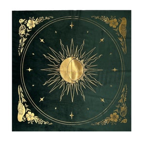 May include: A green velvet tapestry with a gold sun and moon design. The sun and moon are surrounded by stars and a decorative border of birds and flowers.