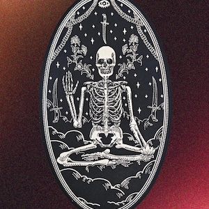 May include: Black oval patch featuring a white skeleton in a meditative pose, surrounded by knives, stars, and floral elements. The design includes a chain border and a dagger above the skull.