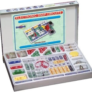 May include: A handmade wooden sign with the text "Welcome" in a playful font. The sign features a distressed white background and a dark brown frame, perfect for a front door or entryway. The sign measures approximately 12 inches wide and 6 inches tall.