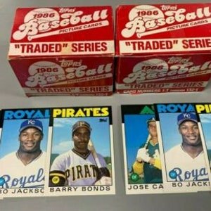 May include: Three baseball cards featuring Jose Canse, Bo Jackson, and Barry Bonds. The cards are from the 1986 Topps Traded Series. The cards are in mint condition and are a great addition to any baseball card collection.