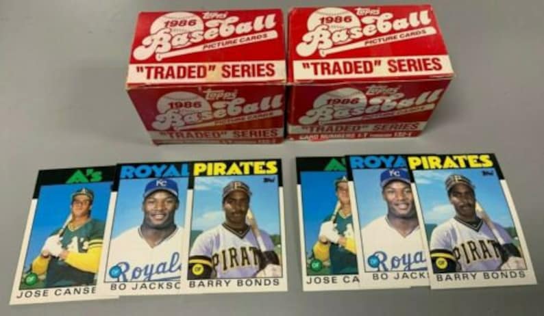 May include: Three baseball cards featuring Jose Canse, Bo Jackson, and Barry Bonds. The cards are from the 1986 Topps Traded Series. The cards are in mint condition and are a great addition to any baseball card collection.
