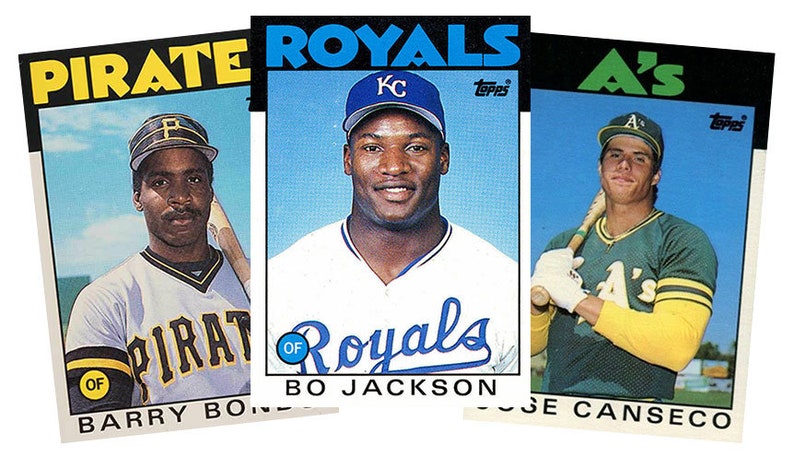 May include: Three baseball cards featuring players from the Pittsburgh Pirates, Kansas City Royals, and Oakland Athletics. The cards are from the 1980s Topps series. The players featured are Barry Bonds, Bo Jackson, and Jose Canseco.