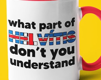 May include: White ceramic mug with a red rim and handle. The mug has the text "what part of HELVITIS don't you understand" printed on it in black.
