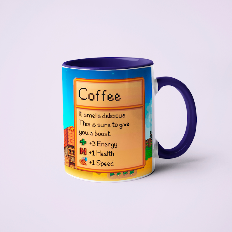 May include: A white coffee mug with a purple rim and handle. The mug features a pixelated design inspired by the video game Stardew Valley. The design includes a text box that reads "Coffee" and describes the benefits of drinking coffee: "It smells delicious. This is sure to give you a boost. +3 Energy +1 Health +1 Speed."