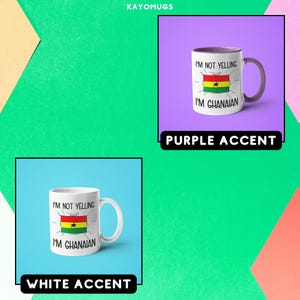May include: Two white coffee mugs with a black and green Ghanaian flag design and the text "I'm not yelling I'm Ghanaian". One mug has a purple accent around the rim and the other has a white accent. The mugs are displayed on a colorful background.