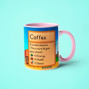 May include: A pink and white coffee mug with a pixelated design featuring the text "Coffee" and a description of the drink's effects: "It smells delicious. This is sure to give you a boost. +3 Energy +1 Health +1 Speed"