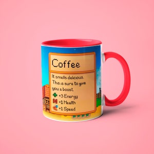 May include: A red and white coffee mug with a pixelated design. The mug features a game-style description of coffee, stating "It smells delicious. This is sure to give you a boost." and lists the benefits as +3 Energy, +1 Health, and +1 Speed.