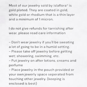 May include: A white informational card titled care + information. It states that islaflora jewelry is gold plated with a minimum of 1 micron. It provides instructions to avoid sweat, humidity, water, lotions, and perfumes, and to store items separately.