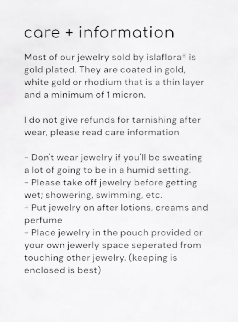 May include: A white informational card titled care + information. It states that islaflora jewelry is gold plated with a minimum of 1 micron. It provides instructions to avoid sweat, humidity, water, lotions, and perfumes, and to store items separately.