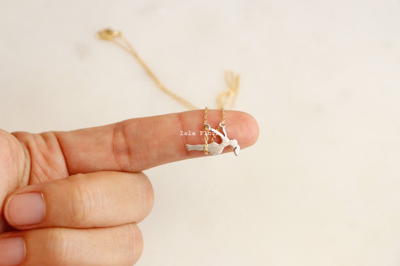 Dainty Girl on Swing Necklace, Two Tone, Play Time Childhood Memories, Nostalgic Gold Minimalist Jewelry, Perfect Gym Teacher, Friend Gift May include: A gold chain necklace with a silver pendant of a woman swinging on a swing.