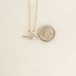 Dainty Girl on Swing Necklace, Two Tone, Play Time Childhood Memories, Nostalgic Gold Minimalist Jewelry, Perfect Gym Teacher, Friend Gift May include: A gold chain necklace with a silver pendant of a person doing a handstand on a swing.