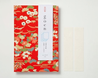 May include: A red patterned box with the word "goen" in white lettering. The box has a floral design with white, blue, and gold accents. Two white rectangular stickers are to the right of the box.