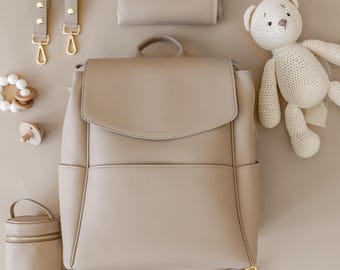 Vegan Leather Diaper Bag Backpack: USB Charging Port, Laptop Pocket & Matching Changing Pad