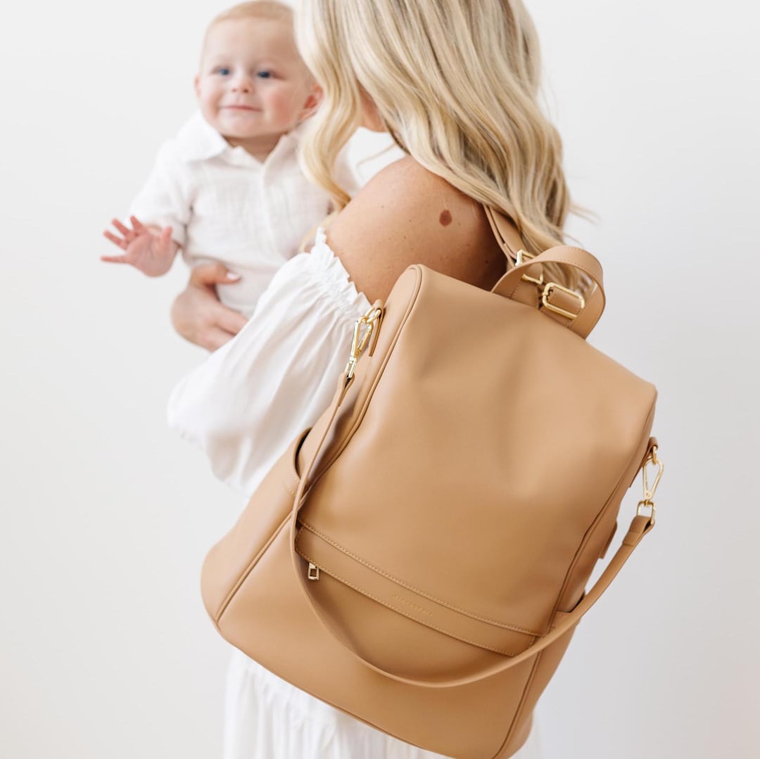 brown leather backpack changing bag VASCHY Diaper for Mum Dad, Unisex Large Waterproof Vegan Baby Bag with Pad,Insulated Pockets,Padded Laptop Sleeve for Travel,Brown : Baby clean butterfly changing pad included Vegan Leather Mini Backpack |