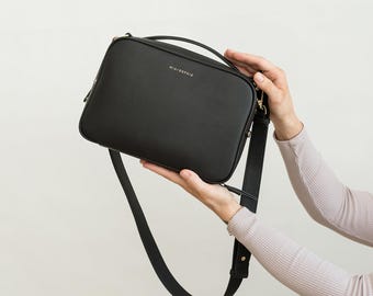 Crossbody Diaper Clutch Includes Leather Changing Pad and Removable Pouch Organizer