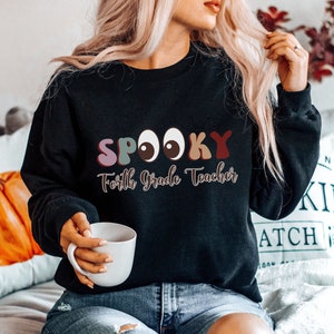 Halloween 4th Grade Teacher Sweatshirt Spooky Forth Grade Teacher Crewneck Shirt Appreciation Teacher Gift Birthday Gift For Teacher.