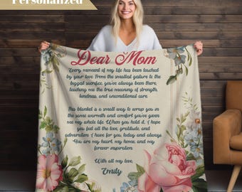 May include: A soft, floral patterned blanket with a heartfelt message to "Dear Mom" printed on it. The message expresses love, gratitude, and appreciation for a mother's unconditional care. The blanket is signed "With all my love, Emily".