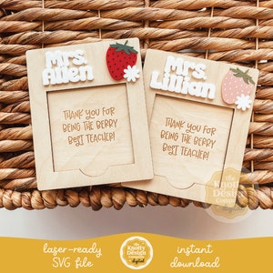 May include: Two laser-cut wooden frames with a strawberry design. The frames have a space for a photo and say "Mrs. Allen" and "Mrs. Lillian" with the text "Thank you for being the berry best teacher!"