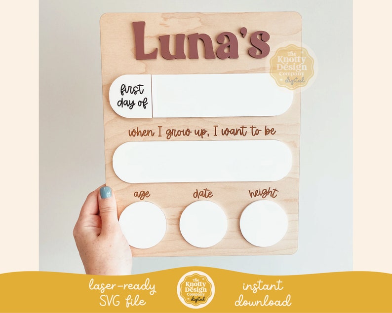 May include: A wooden growth chart with the name "Luna's" in brown lettering. The chart has spaces to record the child's first day, age, date, height, and a section for "when I grow up, I want to be".
