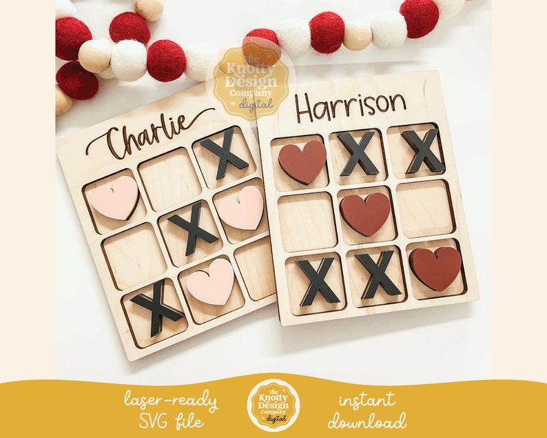 May include: Two wooden tic-tac-toe boards with personalized names "Charlie" and "Harrison". Each board has nine squares with alternating hearts and X's. The hearts are in pink, red, and brown.