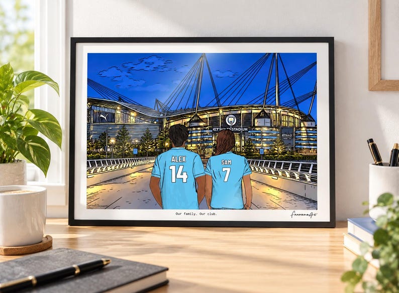 May include: A framed digital illustration depicting two individuals from behind, wearing light blue soccer jerseys with the names ALEX and SAM and numbers 14 and 7, standing before the Etihad Stadium at night. The text reads Our family. Our club.